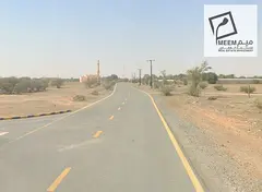 Prime 9,687 Sq Ft Freehold Land on Main Road for Sale in Al Manama 3, Ajman