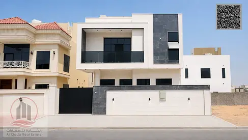 Villa for sale in Ajman, Al Helio area, including registration. 6 master bedrooms, majlis, 2 living rooms, and maid's room. Open to all nationalities.