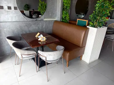 Used brown leather restaurant booth bench with table and chairs set