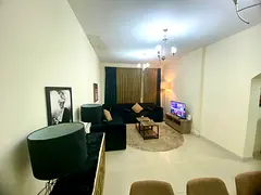 Two bedrooms and a living room / furnished with hotel-style furniture / close to Dubai / Al Taawun /