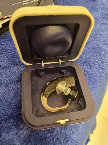 Used behind-the-ear hearing aid with storage case