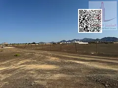 Land for sale, residential/commercial, in Masfout, corner plot on two streets, excellent location.