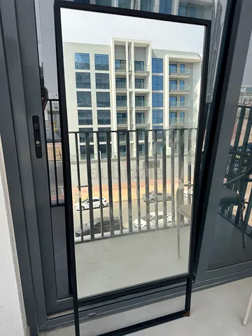 Full-length freestanding mirror with black metal frame