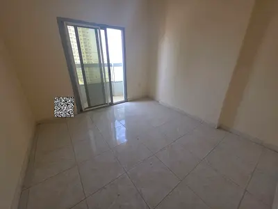 Luxury two-bedroom apartment with a living room for rent in the Emirate of Ajman, specifically in the Al Nuaimiya 1 area.