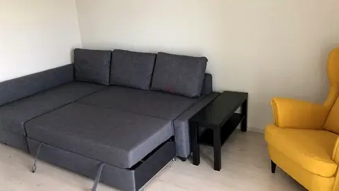 Grey L-shaped Sofa Bed with Side Tables - Good Condition