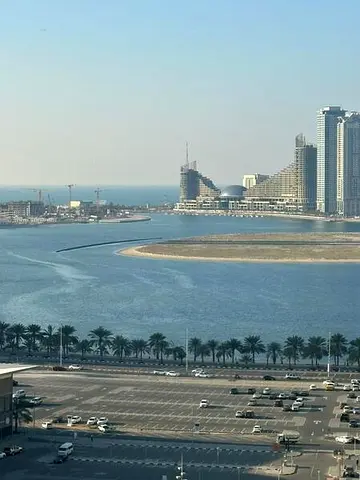 Furnished one-bedroom apartment with a balcony and sea view for monthly rent in Sharjah, Al Taawun area.