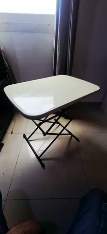 Adjustable table in good working condition