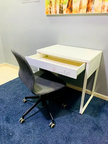 Compact white desk with single drawer and swivel chair