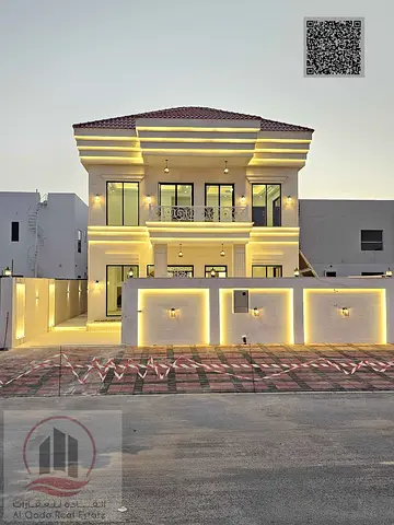 Villa for sale in Ajman, Al Zahia area. 4 master bedrooms, majlis, 2 living rooms, and maid's room. Freehold ownership for all nationalities.