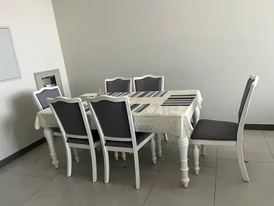 White Dining Table with 6 Grey-Padded Chairs from Home Center