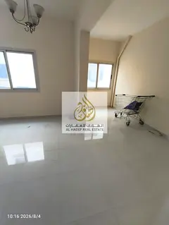 Spacious one-bedroom apartment with a living room, two bathrooms, and built-in wardrobes; located i