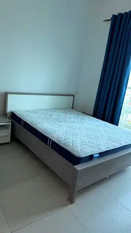 Queen wooden bed frame with mattress and bedside tables - lite use