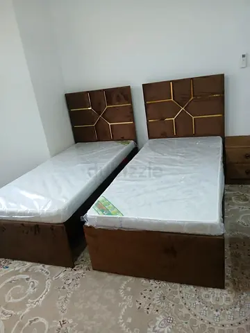 New Pair of single beds with mattresses and headboards
