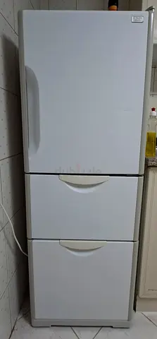 White three-drawer upright freezer - good working condition