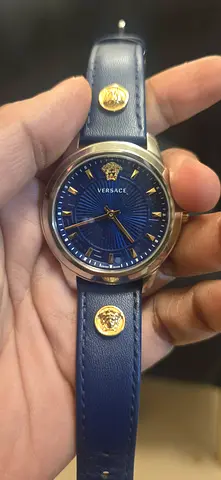 Versace women's blue dial leather strap watch with gold medallions