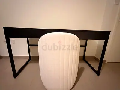 Black minimalist writing desk with cream upholstered chair - good condition