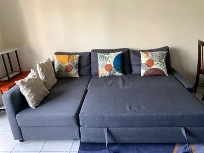 Grey L-shaped Sofa Bed with Storage - Good Condition