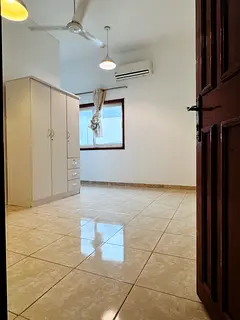 Room with attached kitchen and bathroom