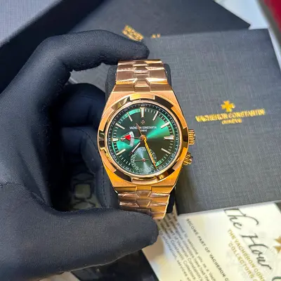 This Vacheron Constantin Overseas Dual Time features a striking green dial housed in 18k pink gold.