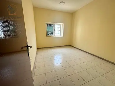 For annual rent in Ajman Al Jurf 2 3-bedroom apartment with a living room 4 bathrooms balcony large kitchen built-in wardrobes ready for immediate