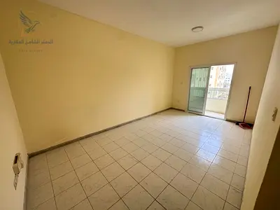 Two bedrooms and a living room with a balcony and central air conditioning, large area