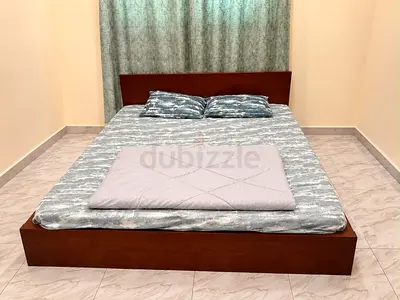 Simple wooden double bed frame with headboard - good condition