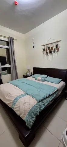 Dark Wood Queen Bed Frame with Headboard and Mattress Setup