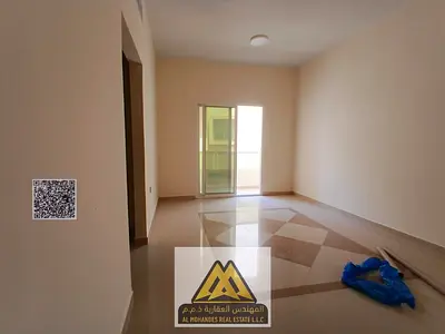 1BR in Al Hamidiya 1, balcony, closed kitchen, central AC, AED 27,997, 4 cheques.