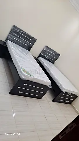 Pair of single beds with mattresses — dark wood frame, brand new