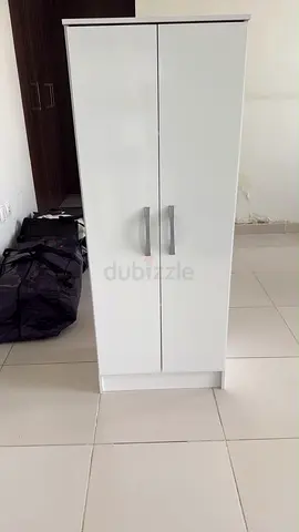 Slim white wardrobe/cabinet with double doors — good condition