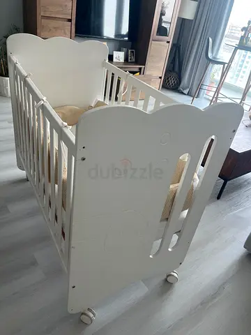 White Wooden Baby Crib with Wheels - Good Condition