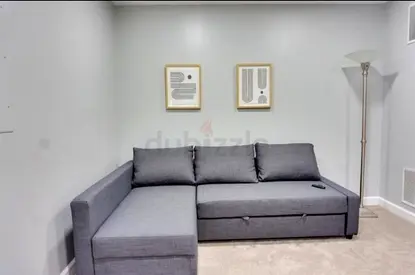 Grey L-shaped Sofa Bed with Storage - Good Condition