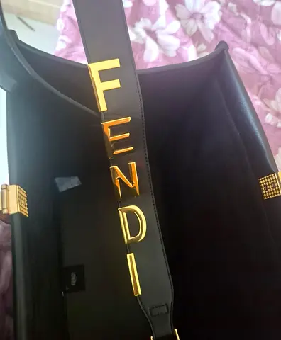 Black Fendi leather shoulder bag with gold logo strap