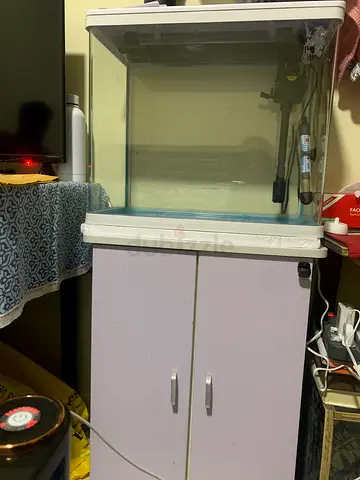 Used fish tank with matching wooden table in good condition.filter, LED light & pump.