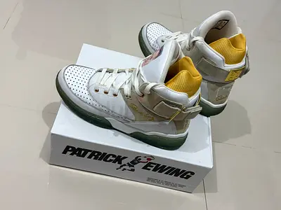 Pair of white high-top sneakers with green sole (men's size 44)