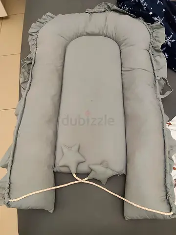 Light grey baby nest lounger / portable infant sleeper