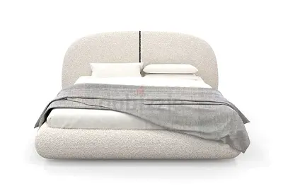 Modern upholstered double bed with curved headboard — cream fabric