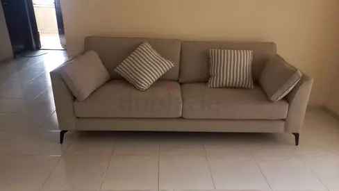 3-seater beige fabric sofa in good condition