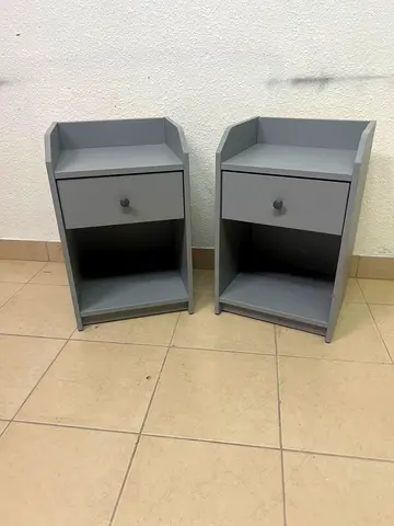Pair of grey bedside nightstands with drawer and shelf