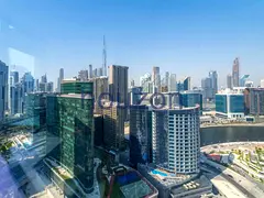 High Floor 1BR | Canal + Burj View | Corner Unit