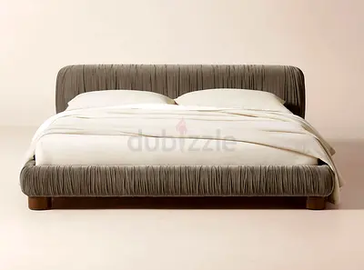 Low-profile upholstered king bed with rounded headboard (grey velvet)