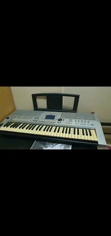 One time used Yamaha Portable Keyboard with Stand and Music Rack