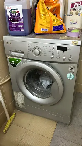 LG front-load washing machine - 7kg, silver, working condition