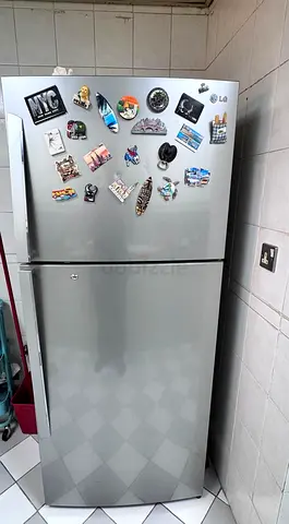 Silver top-freezer refrigerator in good working condition