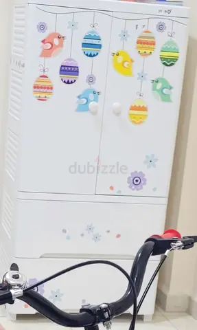White baby dresser/storage cabinet with playful stickers - good condition