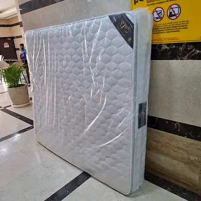 Almost-new king mattress with protective cover