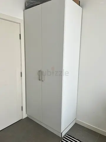 White two-door wardrobe / cupboard in good condition