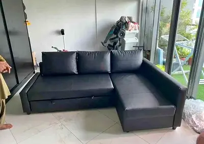 Black L-shaped Leather Sofa with Storage — Good Condition