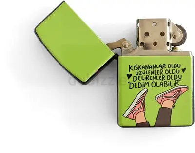 Green collectible flip-top metal lighter with Turkish text and sneaker design 04