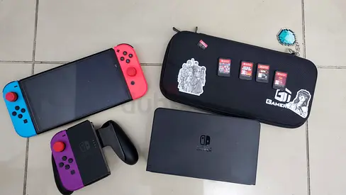 Nintendo switch oled with games and joyycon